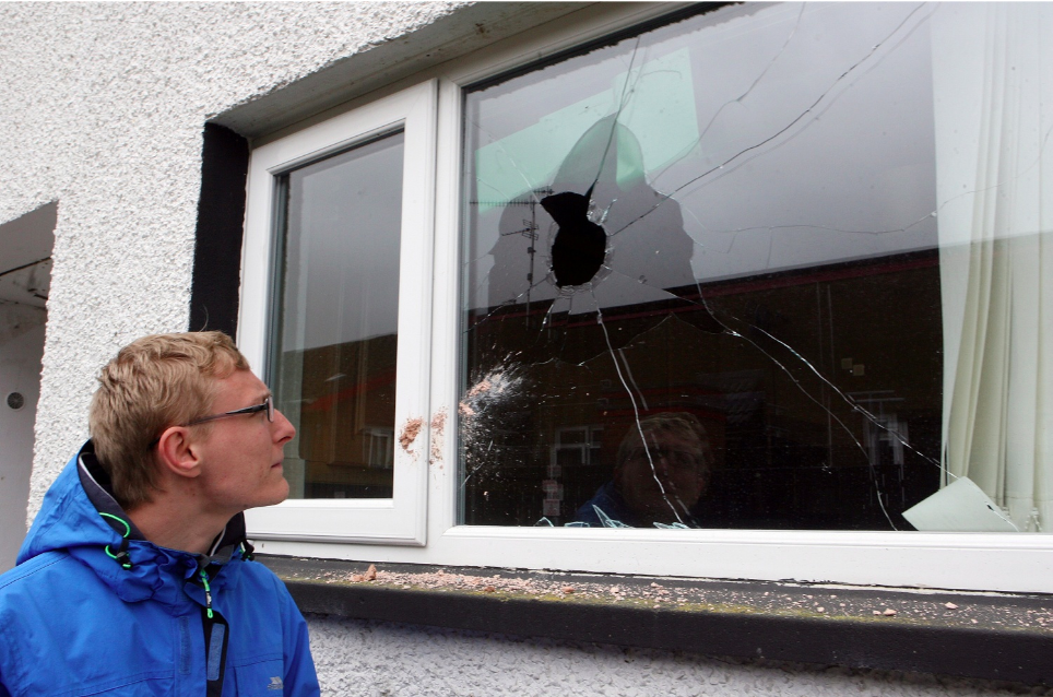 Sick baby lucky to escape injury as brick lands in cot in suspected racist attack